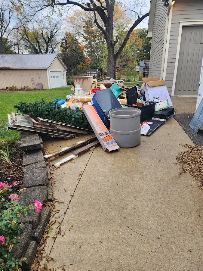 Dumpster being loaded with debris for Demolition Dumpster Rental in Rockwall